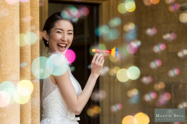 Fun and cool Bridal portrait using bubbles at a Manor by the Lake wedding - Martin Bell Photography