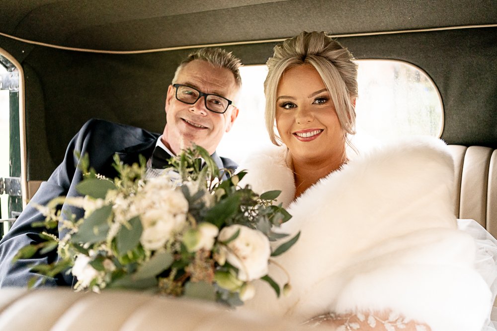 Bride and Father in wedding car