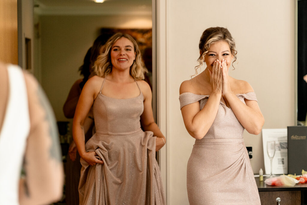 Bridesmaids happy reaction to seeing Bride