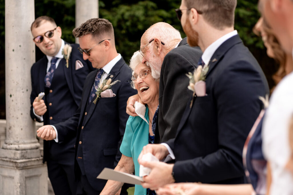 Grandparent laughing at Rhinefield House wedding