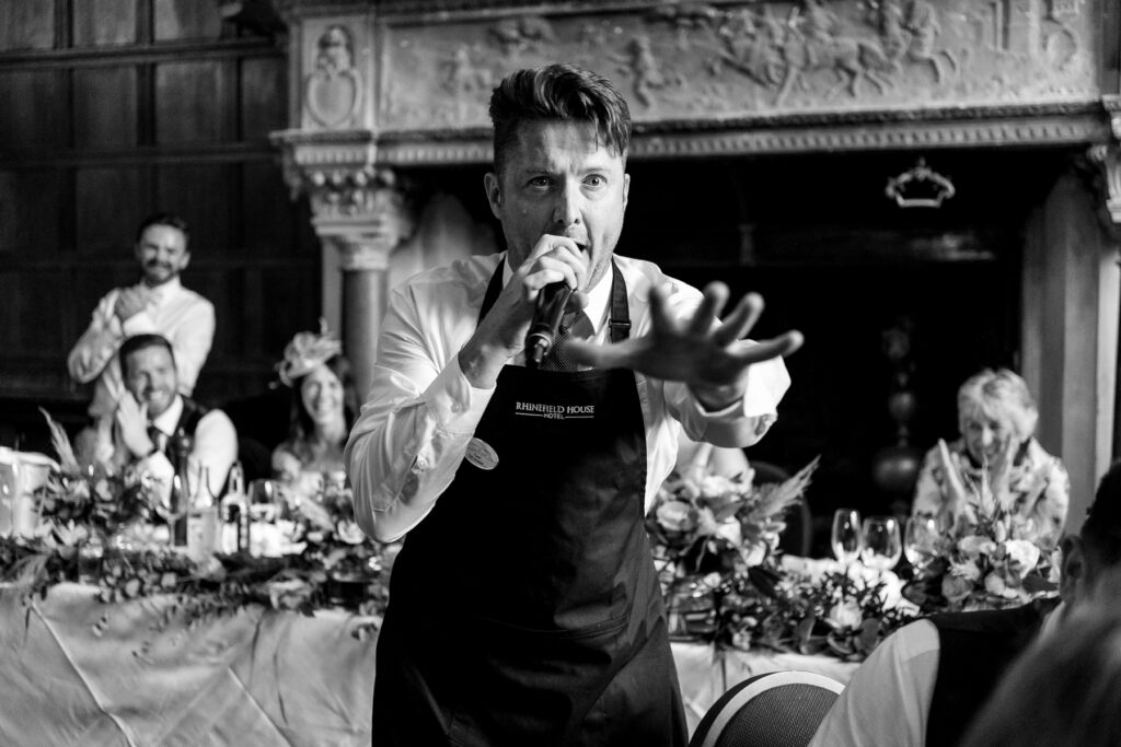 Rhinefield House Hotel Wedding photographer for Ellie and Sam - Singing Waitors