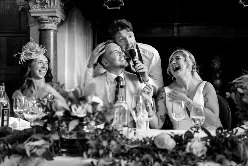 Rhinefield House Hotel Wedding photographer for Ellie and Sam - surprise singing waitors