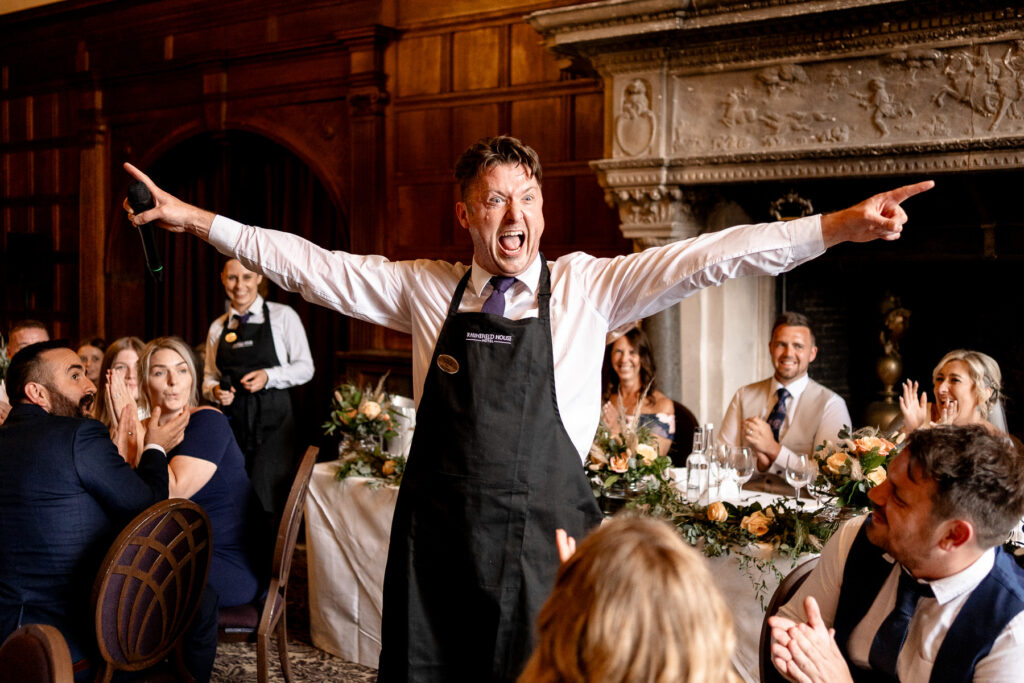 Rhinefield House Hotel Wedding photographer for Ellie and Sam - surprise singing waitors 