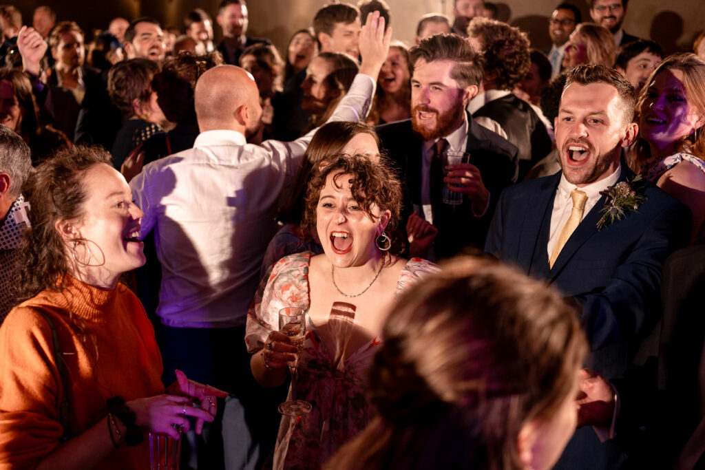 Fun evening party and full dance floor at The Great Barn Devon wedding