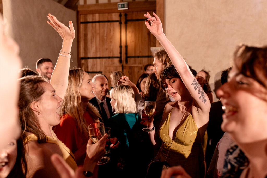 Fun evening party and full dance floor at The Great Barn Devon wedding