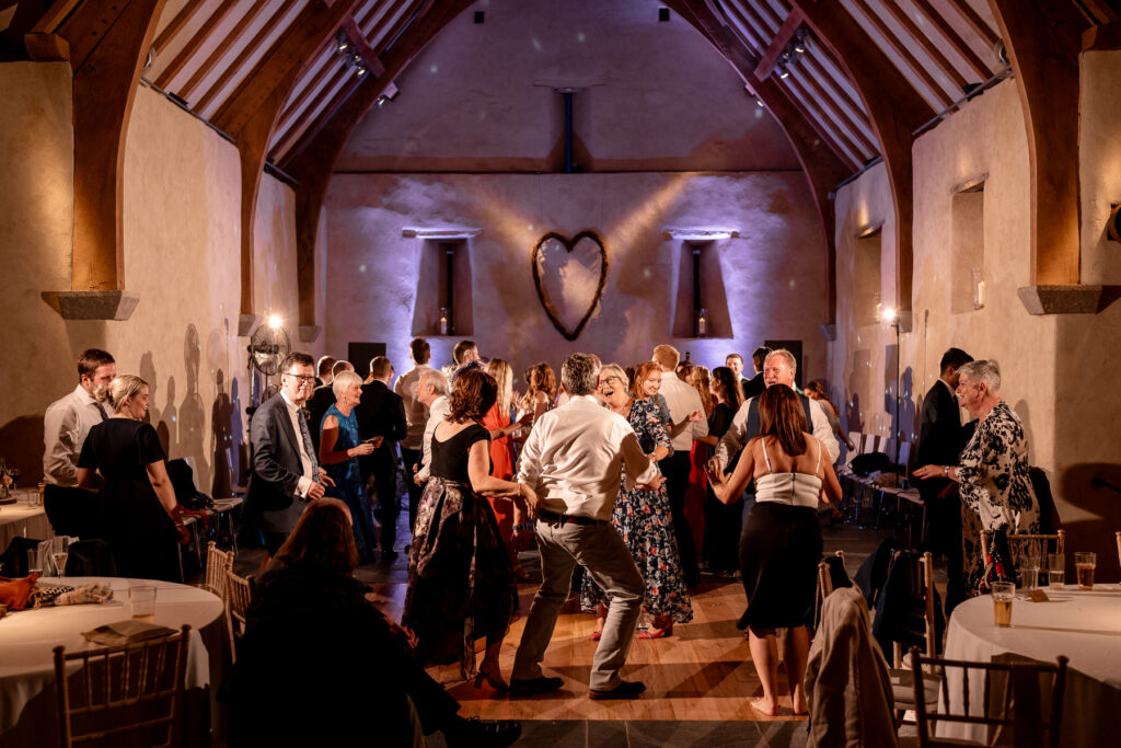 Fun evening party and full dance floor at The Great Barn Devon wedding