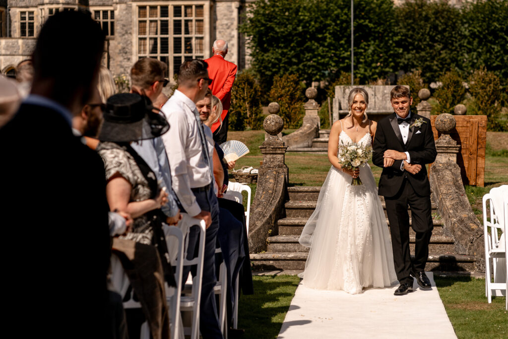 Bride and groom exchanging vows during their Rhinefield House wedding ceremony in the New Forest.