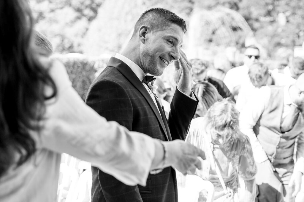 Bride and groom exchanging vows during their Rhinefield House wedding ceremony in the New Forest.