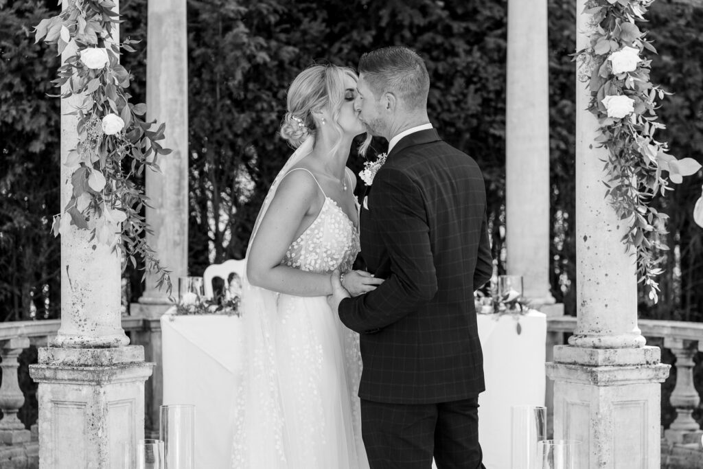 Bride and groom exchanging vows during their Rhinefield House wedding ceremony in the New Forest.