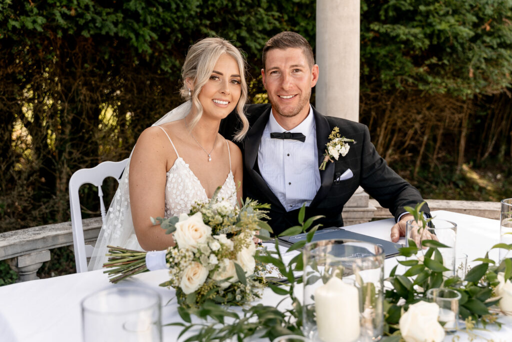 Bride and groom exchanging vows during their Rhinefield House wedding ceremony in the New Forest.
