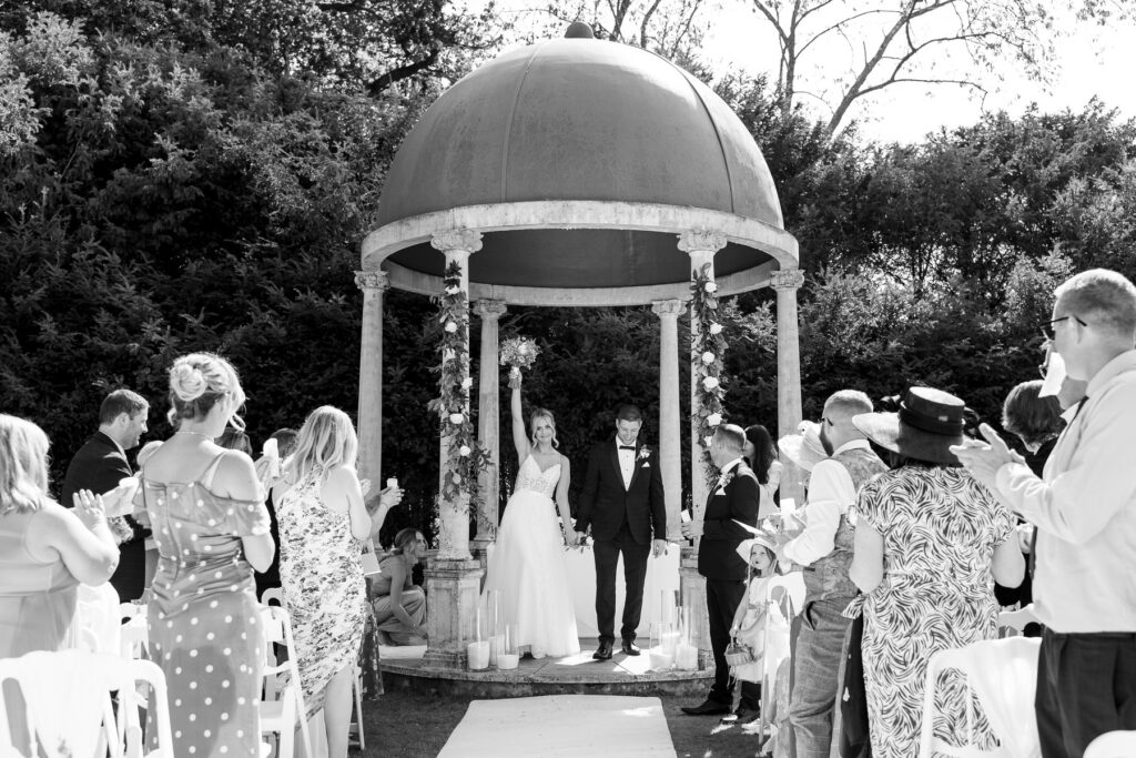 Bride and groom exchanging vows during their Rhinefield House wedding ceremony in the New Forest.