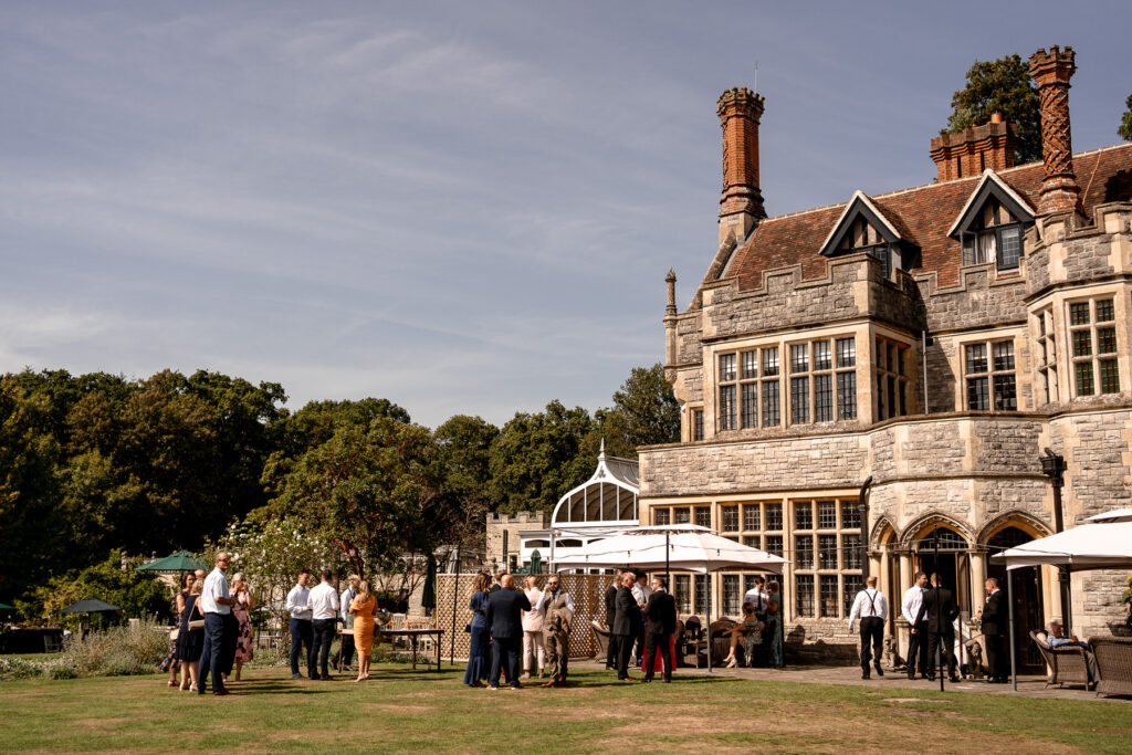 The stunning exterior of Rhinefield House Hotel surrounded by forest, one of Hampshire’s most beautiful wedding venues.
