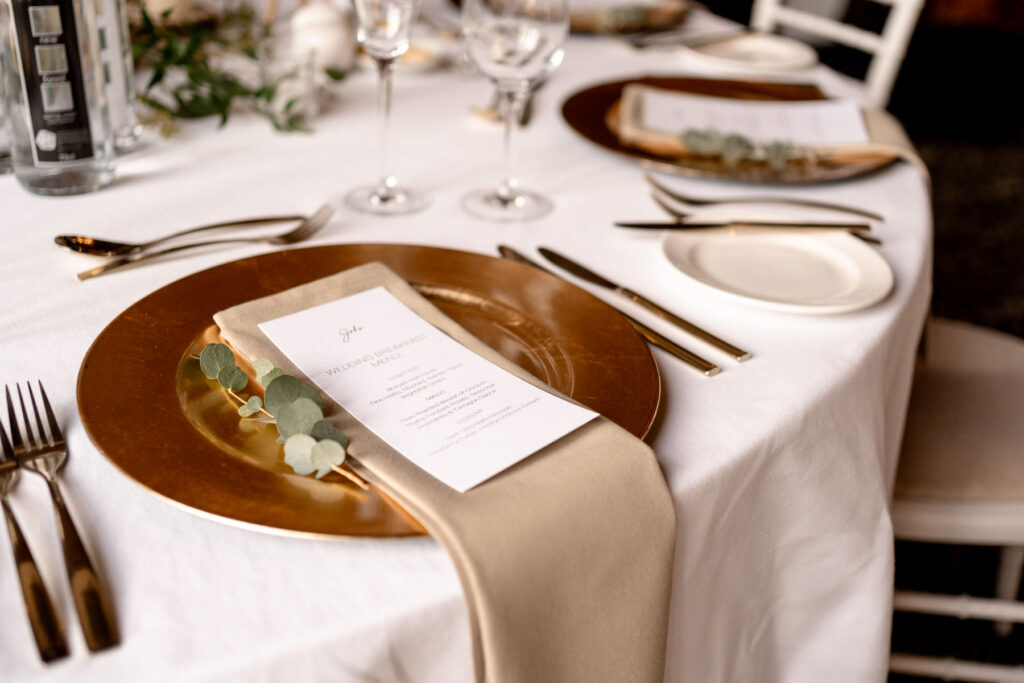 Elegant black-tie wedding reception setup at Rhinefield House Hotel.