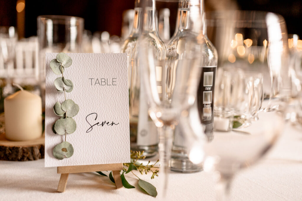 Elegant black-tie wedding reception setup at Rhinefield House Hotel.