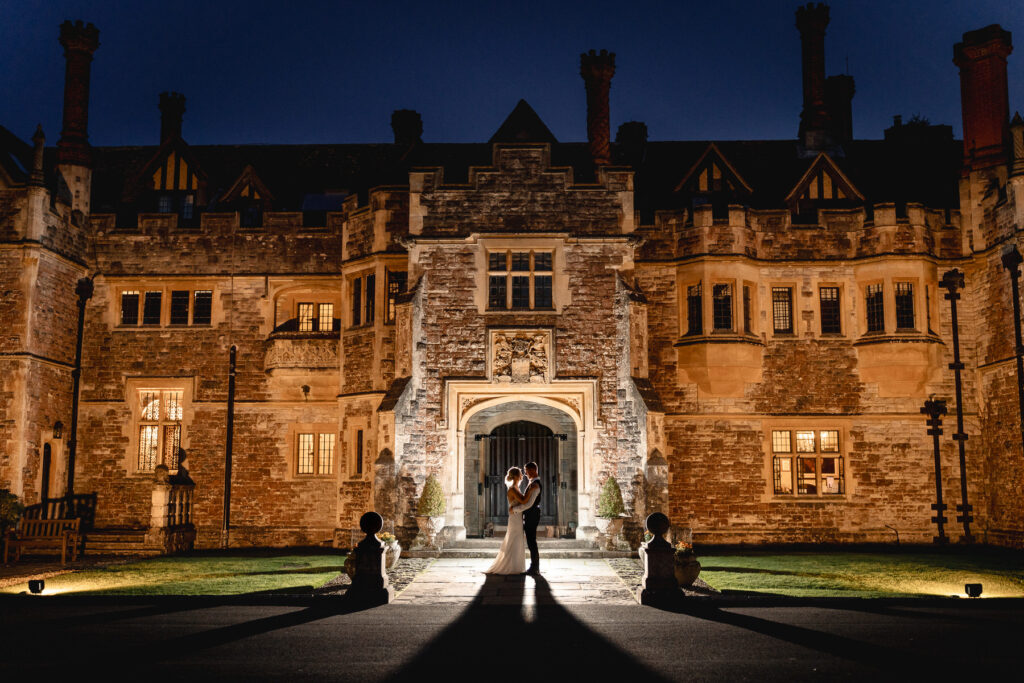 The stunning exterior of Rhinefield House Hotel surrounded by forest, one of Hampshire’s most beautiful wedding venues.
