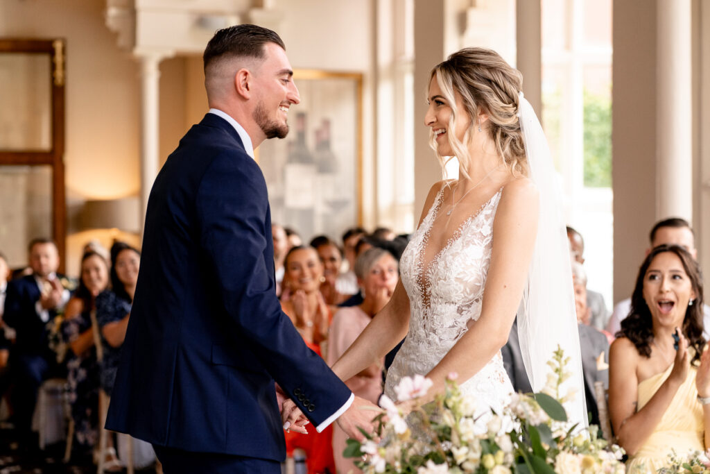 wedding ceremony laughs at a Summer wedding at Audleys Wood