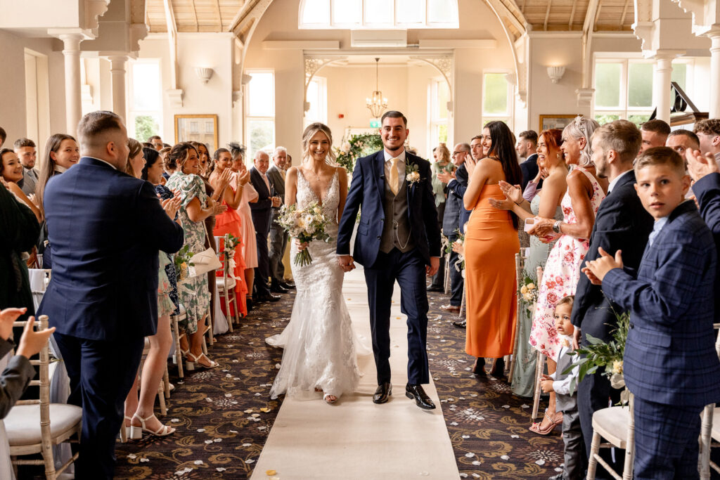 ceremony exit at a Summer wedding at Audleys Wood