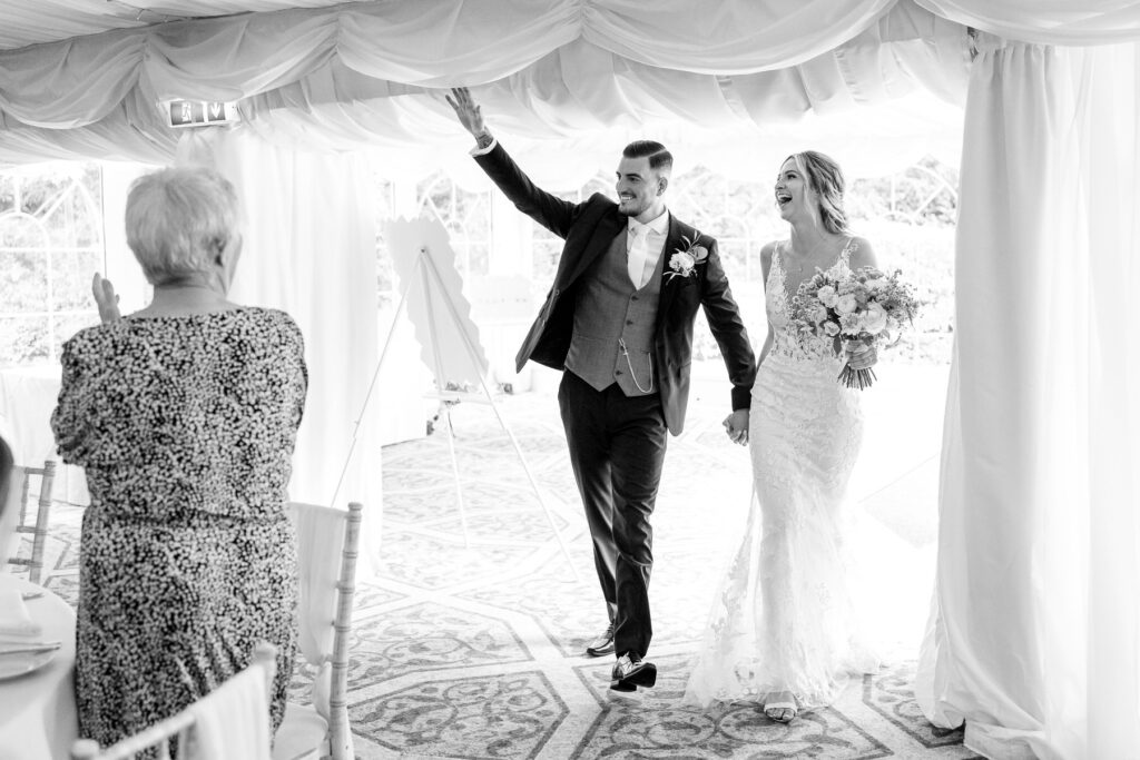 Bride and Grooms epic entrance at a Summer wedding at Audleys Wood