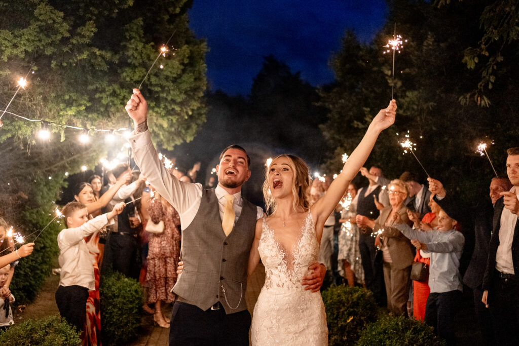 sparkler exit at a Summer wedding at Audleys Wood